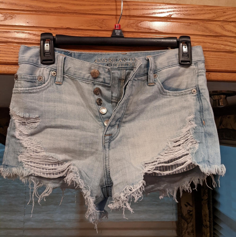Destressed blue jean shorts